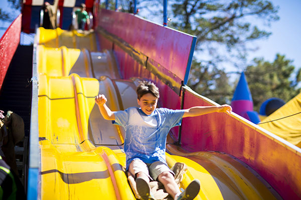 Kids enjoying fair ground rides at Floriade Canberra.