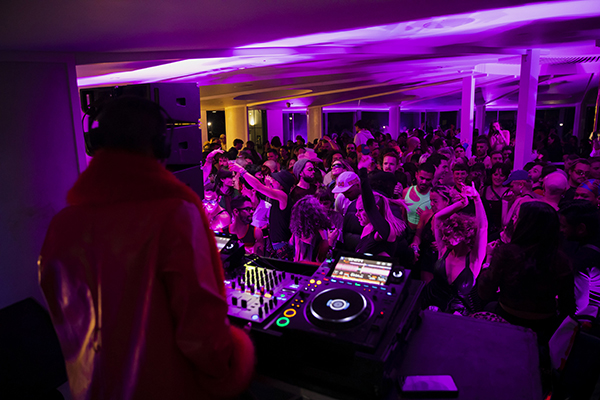 People enjoy the music at the Terrace on the Domain at Sydney's Botanic Gardens, during Vivid Sydney 2022.