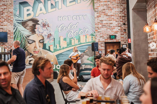 Guests enjoying food, beer, and live music at the Balter Brewing Taproom