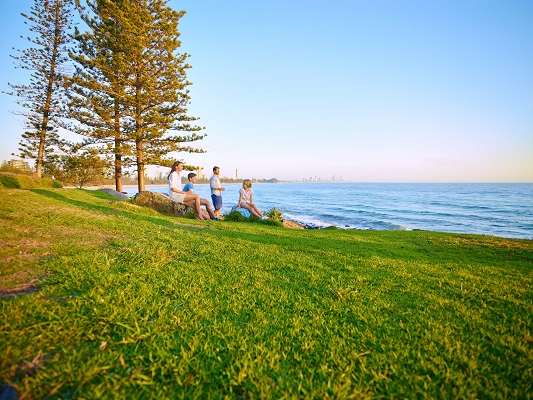 A family watching the waves at Burleigh Hill, Gold Coast