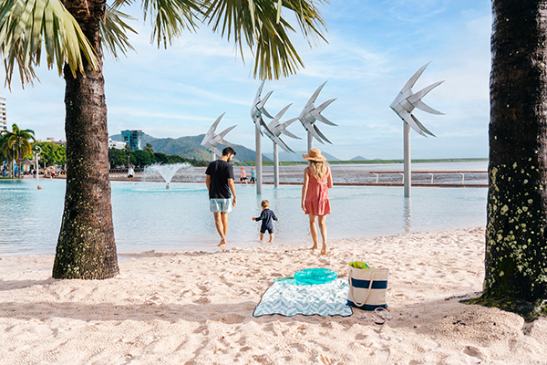 Family of 3 walking into Cairns Esplanade Lagoon