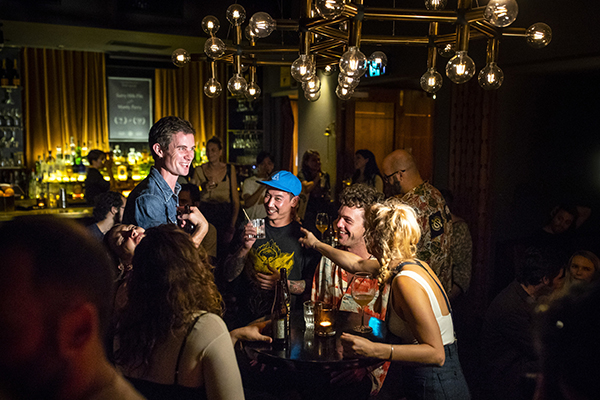 Patrons enjoying drinks and live music at Golden Age Cinema & Bar, Surry Hills.