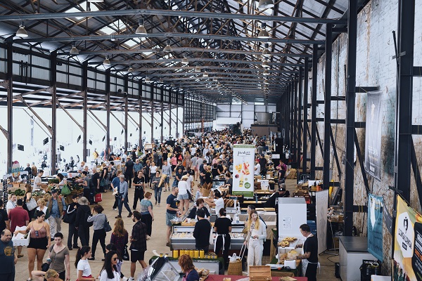 Crowds enjoying a day out at Carriageworks Markets in Eveleigh, Sydney