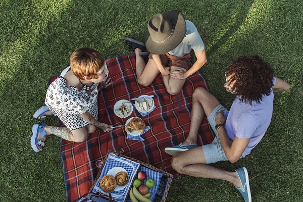 Friends enjoying a picnic in the Royal Botanic Garden Sydney