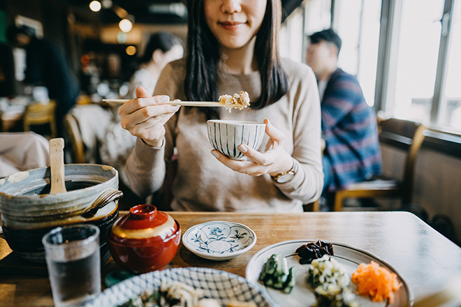 Girl enjoying food while travelling 