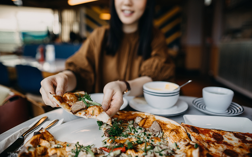 Man eating huge portions of food.