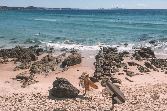 Two surfers leaving the beach on the Gold Coast