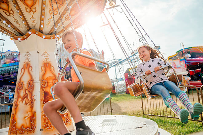 Kids enjoying rides at Light up the Lake 