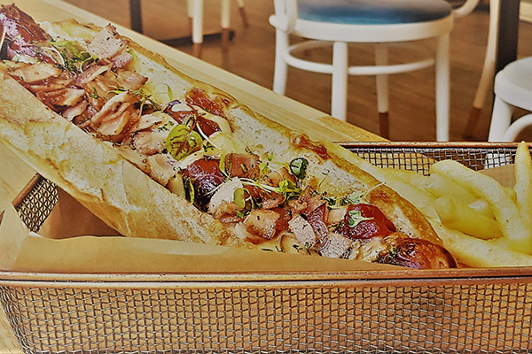 Loaded foot-long Hotdog with Fries. Recipe from Goldfinch Restaurant and Street Café at Pullman & Mercure Brisbane King George Square