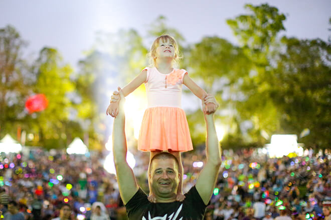 family enjoying evening fireworks at Parramatta Park