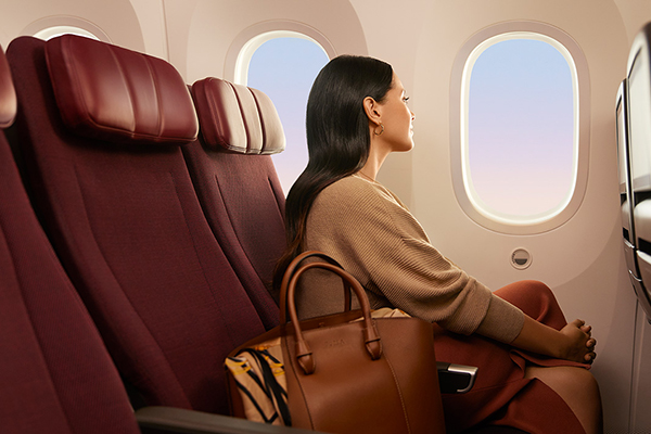 Woman sat in a plane, enjoying the view