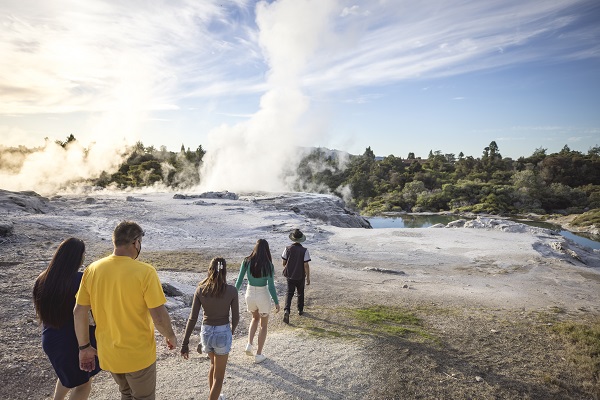 A group walk across to Rotorua hot springs. Image credit: Tourism NZ