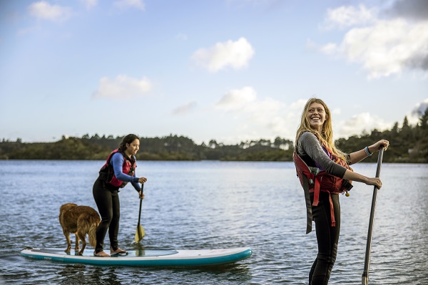 Paddle boarders enjoying the view. Image credit: Tourism NZ
