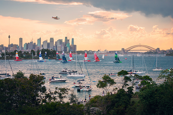 Boats race across the harbour during the Australia Sail Grand Prix, Sydney