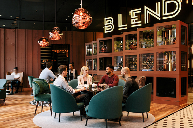 People sitting together around a table at the Blend Restaurant| ALL – Accor Live Limitless