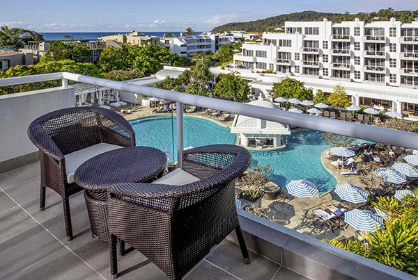 View of pool setting and beach beyond at Sofitel Noosa Pacific Resort