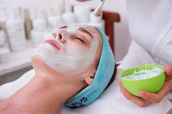 Woman experiencing a facial treatment at a Sydney Spa 