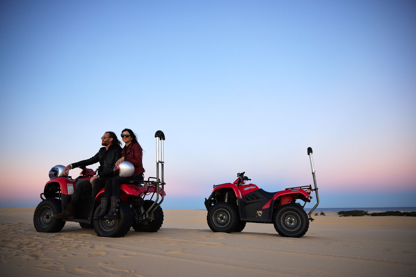 Couple enjoying an Aboriginal Culture and Quad Bike Tour with Sand Dune Adventures, Port Stephens. Image credit: Destination NSW