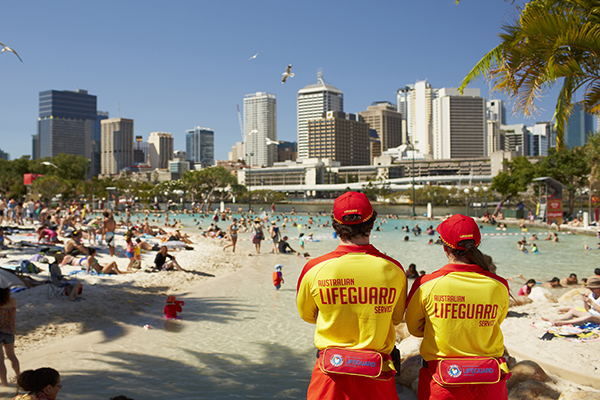 Streets beach in Brisbane, monitored by lifeguards and looking out into the city. Credit: Tourism Australia