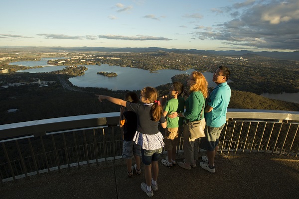 A family looking out over Canberra from Telstra Tower