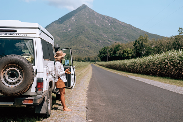 woman in a 4x4 looking out to Walsh's Pyramid