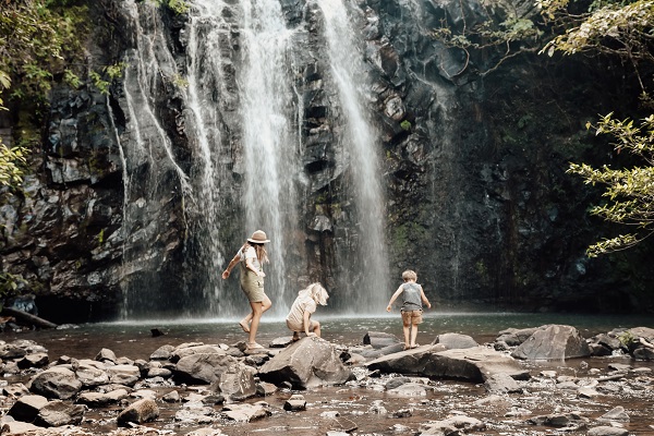 A family enjoying a natural waterhole in the Gold Coast